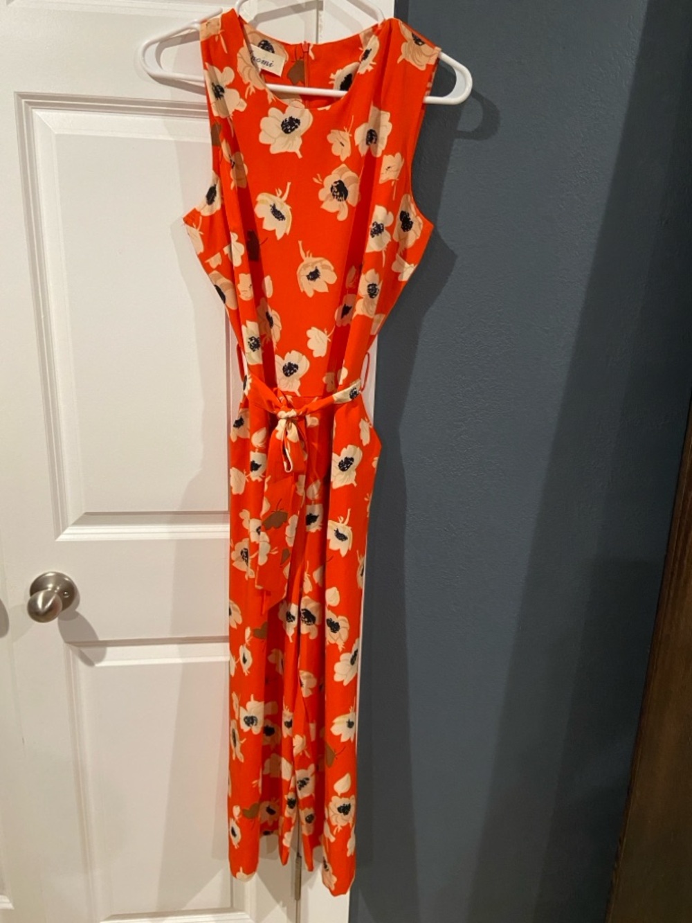 Orange Jumpsuit with Cream and Black Floral Accents
